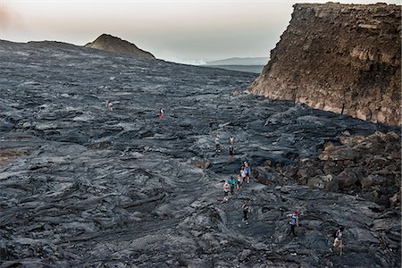 danakil depression - Tourists walking through lava field around the very active Erta Ale shield volcano, Danakil depression, Ethiopia, Africa Stock Photo - Rights-Managed, Code: 841-09076826