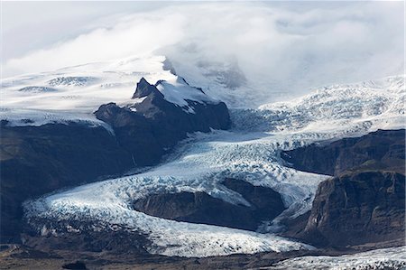 Tongue of the Vatnajokull Glacier creeping down the mountains behinf Fjallsarlon lagoon, South Iceland, Polar Regions Fotografie stock - Rights-Managed, Codice: 841-09076980