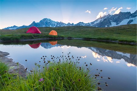 simsearch:841-09242283,k - Camping tents in the green meadows surrounded by flowers and alpine lake, Mont De La Saxe, Courmayeur, Aosta Valley, Italy, Europe Stock Photo - Rights-Managed, Code: 841-09085851