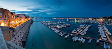 province of lecce - Dusk lights the harbor and the medieval old town of Otranto, Province of Lecce, Apulia, Italy, Europe Stock Photo - Rights-Managed, Code: 841-09085872