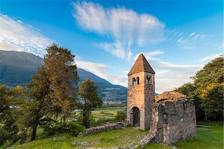 Sunset sky frames the ancient Abbey of San Pietro in Vallate, Piagno, Sondrio province, Lower Valtellina, Lombardy, Italy, Europe Stock Photo - Rights-Managed, Code: 841-09085892