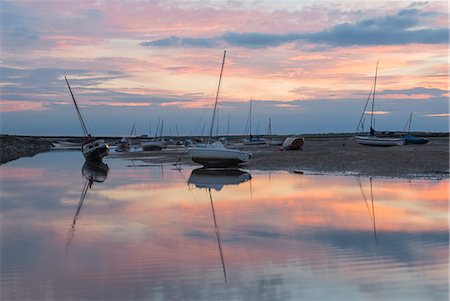 simsearch:841-08279472,k - Sunset over the tidal channel at Brancaster Staithe, Norfolk, England, United Kingdom, Europe Stock Photo - Rights-Managed, Code: 841-09086599