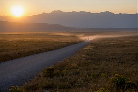 simsearch:841-09086523,k - Car on dusty road at sunset, Grand Teton Park, Wyoming, United States of America, North America Stock Photo - Rights-Managed, Code: 841-09135338