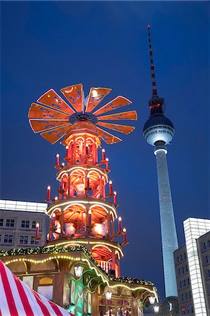 Christmas Pyramid at Christmas market in Alexanderplatz with Fernsehturm television tower behind, Berlin-Mitte, Berlin, Germany, Europe Stock Photo - Rights-Managed, Code: 841-09135464