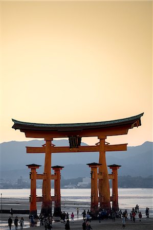 Tourists walking under the torii gate of Miyajima at low tide, Itsukushima, UNESCO World Heritage Site, Hiroshima Prefecture, Honshu, Japan, Asia Stock Photo - Rights-Managed, Code: 841-09163587