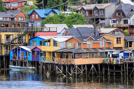 pictures of colourful buildings latin america - Palafitos, colourful stilt houses on water's edge, elevated view, unique to Chiloe, Castro, Isla Grande de Chiloe, Chile, South America Stock Photo - Rights-Managed, Code: 841-09174530