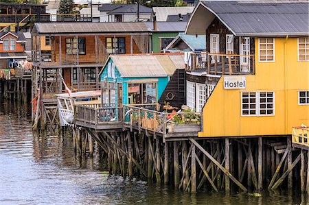 Palafitos, colourful stilt houses on water's edge, unique to Chiloe, Castro, Isla Grande de Chiloe, Chile, South America Photographie de stock - Rights-Managed, Code: 841-09174533