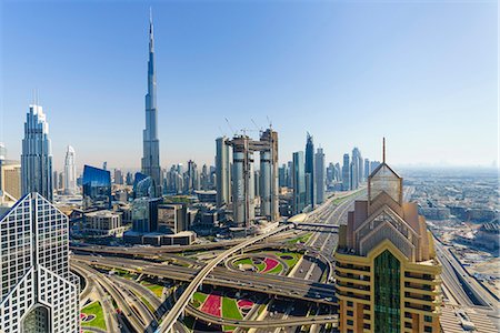 simsearch:841-07355218,k - Dubai skyline and Sheikh Zayed Road Interchange, Dubai, United Arab Emirates, Middle East Stock Photo - Rights-Managed, Code: 841-09174621