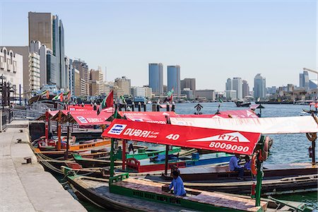 Abras, traditional water taxis crossing Dubai Creek between Deira and Bur Dubai, Dubai, United Arab Emirates, Middle East Stock Photo - Rights-Managed, Code: 841-09174639