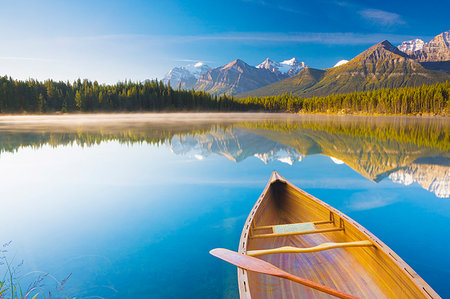 reflection and symmetry - Canoe on Herbert Lake at sunrise, Banff National Park, UNESCO World Heritage Site, Alberta, Rocky Mountains, Canada, North America Stock Photo - Rights-Managed, Code: 841-09194267