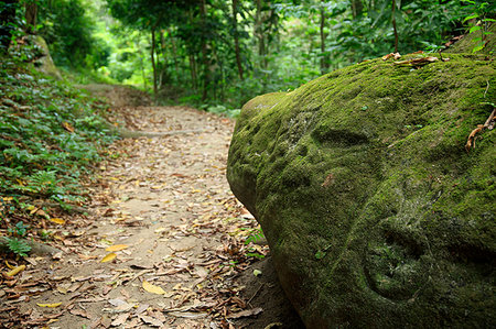 pictograph - A carved petroglyph on a rock on the hiking trail to Pueblito in Tayrona National Park, Magdalena State, Colombia, South America Stock Photo - Rights-Managed, Code: 841-09194292