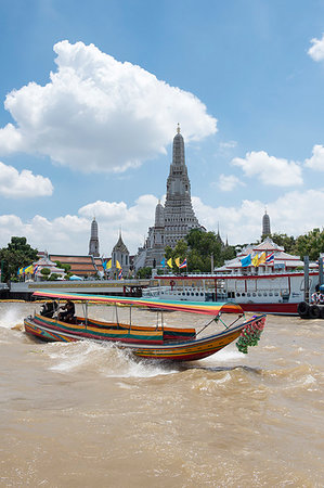 famous historical buildings of thailand - Wat Arun (Temple of Dawn), Ruea Hang Yao (long tail boat) on the Chao Phraya River, at sunset, Bangkok, Thailand, Southeast Asia, Asia Stock Photo - Rights-Managed, Code: 841-09256625