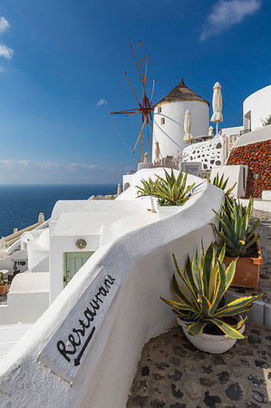 View of windmill overlooking Oia village, Santorini, Cyclades, Aegean Islands, Greek Islands, Greece, Europe Stock Photo - Rights-Managed, Code: 841-09257077