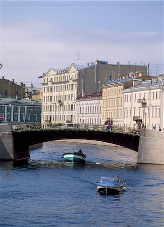 Small boats pass under a bridge on the Moika River in St Petersburg, Russia Stock Photo - Rights-Managed, Code: 841-02704227