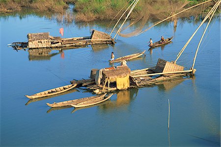 Fishing rafts and fishermen on canoes in Cambodia, Indochina, Southeast Asia, Asia Foto de stock - Con derechos protegidos, Código: 841-02704443