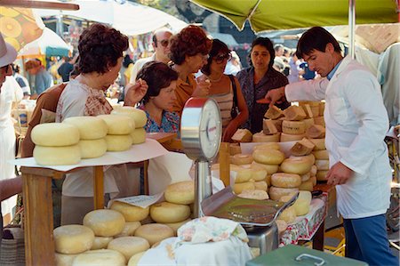 Shoppers tasting cheeses at a cheese stall in the market in Siena, Tuscany, Italy, Europe Stock Photo - Rights-Managed, Code: 841-02704650