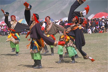 Men in traditional Tibetan dress, Yushu Horse Fetival, Qinghai Province, China, Asia Fotografie stock - Rights-Managed, Codice: 841-02704762