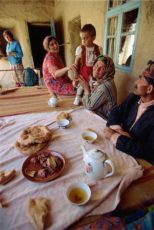 Tajik family at table with typical offering of mutton, tea and bread, near Ayni, Tajikistan, Central Asia, Asia Stock Photo - Rights-Managed, Code: 841-02704890