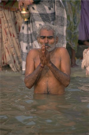 Hindu religious rites in the holy River Ganges (Ganga), Varanasi (Benares), Uttar Pradesh, India, Asia Stock Photo - Rights-Managed, Code: 841-02705576