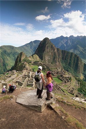 south american country peru - Tourists looking out over the ruins of the Inca site, Machu Picchu, UNESCO World Heritage Site, Urubamba Province, Peru, South America Stock Photo - Rights-Managed, Code: 841-02705636