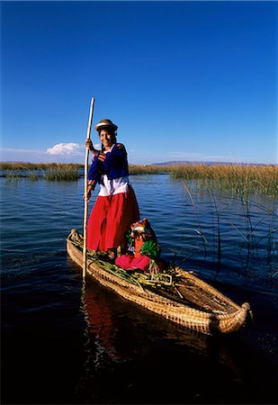 peru lake - Uros Indian woman and traditional reed boat, Islas Flotantes, Lake Titicaca, Peru, South America Stock Photo - Rights-Managed, Code: 841-02705647