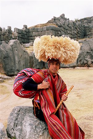 sacsayhuaman - Portrait of a young Peruvian man in traditional dress, with a flute, Inca ruins of Sacsayhuaman, Cuzco, Peru, South America Foto de stock - Con derechos protegidos, Código: 841-02705677