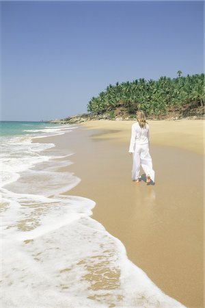 simsearch:841-02711117,k - Woman tourist walking along the beach, Kovalam, Kerala state, India, Asia Stock Photo - Rights-Managed, Code: 841-02705801