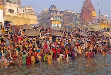 Hindu religious morning rituals in the Ganges (Ganga) River, Makar Sankranti festival, Varanasi (Benares), Uttar Pradesh State, India Stock Photo - Rights-Managed, Code: 841-02706116