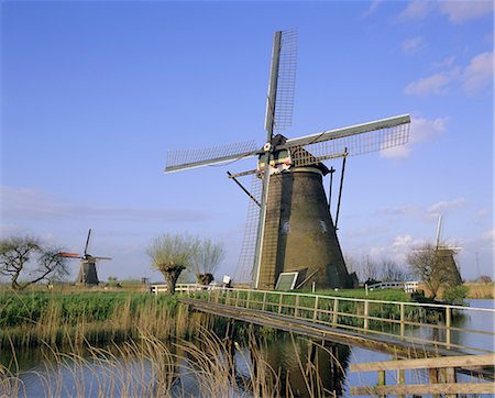 Windmills along the canal, Kinderdijk, UNESCO World Heritage Site, Holland (The Netherlands), Europe Foto de stock - Con derechos protegidos, Código: 841-02706437