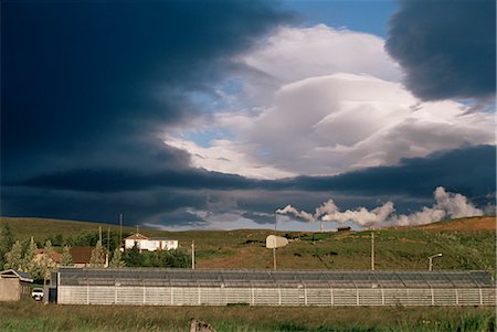 strokkur geyser - Greenhouses heated by geothermal springs, near Geysir, Reykholt, Iceland, Polar Regions Stock Photo - Rights-Managed, Code: 841-02706768