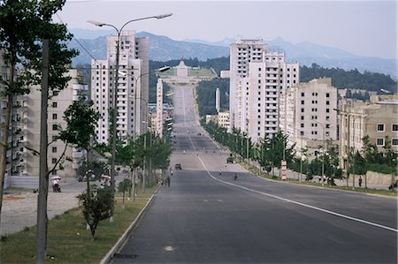 High-rise flats and over-sized street, with lack of traffic, Kaesong, North Korea, Asia Stock Photo - Rights-Managed, Code: 841-02706895