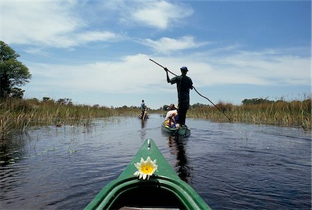 simsearch:841-02901625,k - Tourists in dug out canoe (mokoro), Okavango Delta, Botswana, Africa Stock Photo - Rights-Managed, Code: 841-02707307