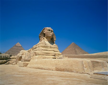 sphinx egypt - The Great Sphinx and two of the pyramids at Giza, UNESCO World Heritage Site, Cairo, Egypt, North Africa, Africa Stock Photo - Rights-Managed, Code: 841-02707770