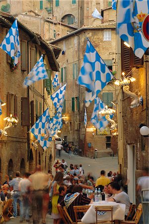 palio siena - Palio banquet for members of the Onda (Wave) contrada, Siena, Tuscany, Italy, Europe Stock Photo - Rights-Managed, Code: 841-02708714