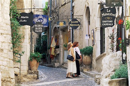 Window shopping in medieval village street, St. Paul de Vence, Alpes-Maritimes, Provence, France, Europe Stock Photo - Rights-Managed, Code: 841-02708860