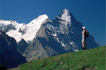 simsearch:614-02984633,k - Hiker looking to the snow-covered Monch and the north face of the Eiger, Gross Scheidegg, Grindelwald, Bern, Swiss Alps, Switzerland, Europe Stock Photo - Rights-Managed, Code: 841-02708888