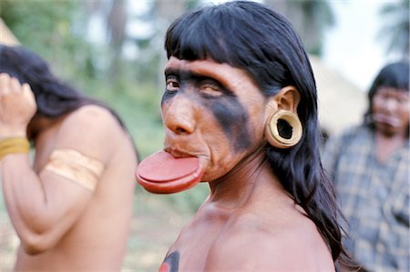 Portrait of a Suya Indian man with lip plate, Brazil, South America (1971) Stock Photo - Rights-Managed, Code: 841-02709383