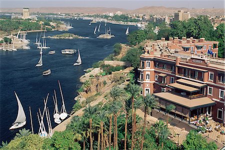 Feluccas on the River Nile and the Old Cataract Hotel, Aswan, Egypt, North Africa, Africa Stock Photo - Rights-Managed, Code: 841-02709569