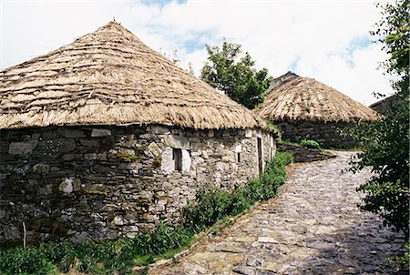 straw huts - Rounded thatched pallozas of Celtic origin, Cebreiro, Lugo area, Galicia, Spain, Europe Stock Photo - Rights-Managed, Code: 841-02703415