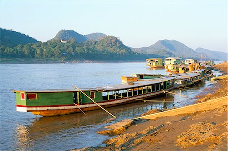 picture countryside of laos - Looking north up the Mekong River, boats moored at Luang Prabang, Laos, Indochina, Southeast Asia, Asia Stock Photo - Rights-Managed, Code: 841-02703859