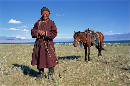 Lake Uureg Nuur, nomad and his horse, Uvs, Mongolia, Central Asia, Asia Foto de stock - Con derechos protegidos, Código: 841-02714688