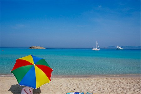 simsearch:841-02714843,k - Colourful umbrella on Playa de ses Illetes beach, Formentera, Balearic Islands, Spain, Mediterranean, Europe Stock Photo - Rights-Managed, Code: 841-02714749