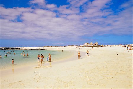 People playing on the beach and natural swimming pool beyond, near El Cotillo, Fuerteventura, Canary Islands, Spain, Atlantic Ocean, Europe Stock Photo - Rights-Managed, Code: 841-02714843