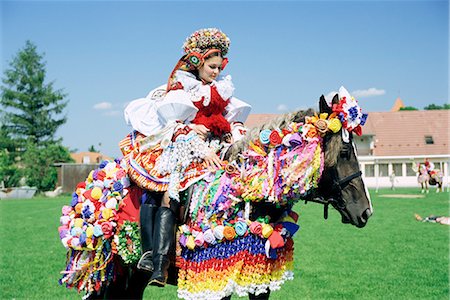 riding outfit - Young woman wearing folk dress on horseback, Ride of the Kings Festival, village of Vlcnov, Moravian Slovacko, Vlcnov, Zlinsko, Czech Republic, Europe Stock Photo - Rights-Managed, Code: 841-02717028