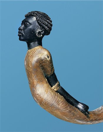 Un adversaire africain sculpté sur l'extrémité inférieure d'une canne de cérémonie, de la tombe du pharaon Toutankhamon, découvert dans la vallée des rois, Thèbes, Afrique du Nord Afrique Photographie de stock - Rights-Managed, Code: 841-02717825