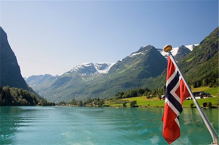 Sailing on the green lake and Norwegian flag, Olden, Fjordland, Norway, Scandinavia, Europe Stock Photo - Rights-Managed, Code: 841-02718035