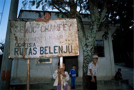 Semuc Champey sign in town of Coban, with local kids, Guatemala, Central America Stock Photo - Rights-Managed, Code: 841-02718635