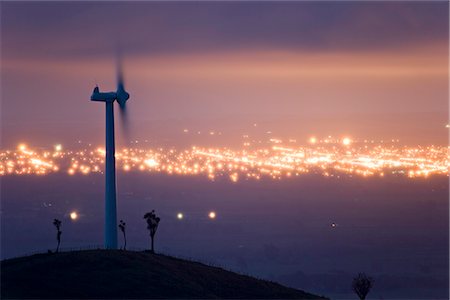 energy windmill hills - Te Apiti Wind Farm at dawn, on the lower Ruahine Ranges, with the lights of Palmerston North beyond, Manawatu, North Island, New Zealand, Pacific Stock Photo - Rights-Managed, Code: 841-02718698