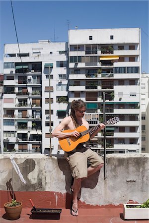 simsearch:841-02717144,k - Man playing guitar on rooftop, Buenos Aires, Argentina, South America Stock Photo - Rights-Managed, Code: 841-02719554