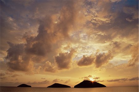 Sunrise behind Bainbridge Rocks, off James Island, Galapagos Islands, UNESCO World Heritage Site, Ecuador, Pacific, South America Stock Photo - Rights-Managed, Code: 841-02719839